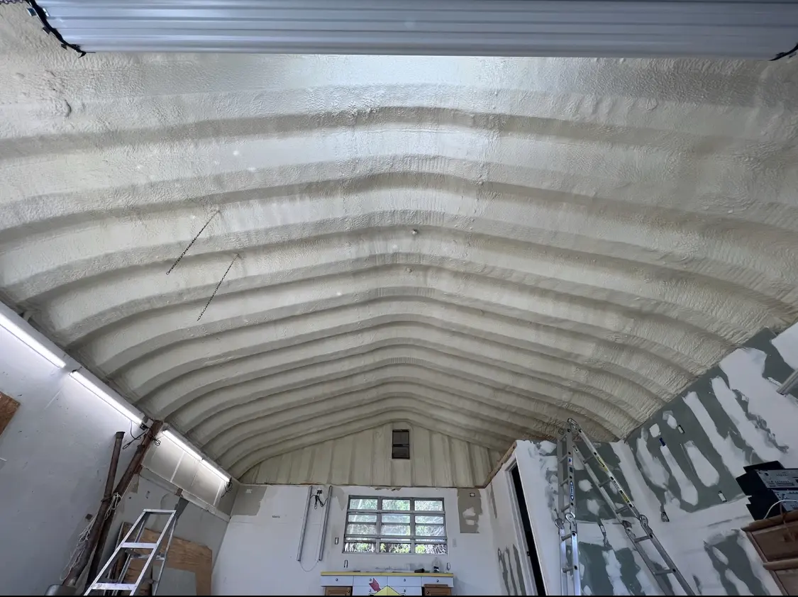 Spray polyurethane foam applied to the underside of a metal roof deck in Hutchison